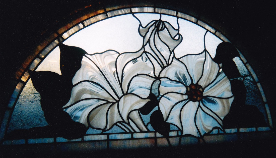 Half round petunia stained glass window by spectrum stained glass studio